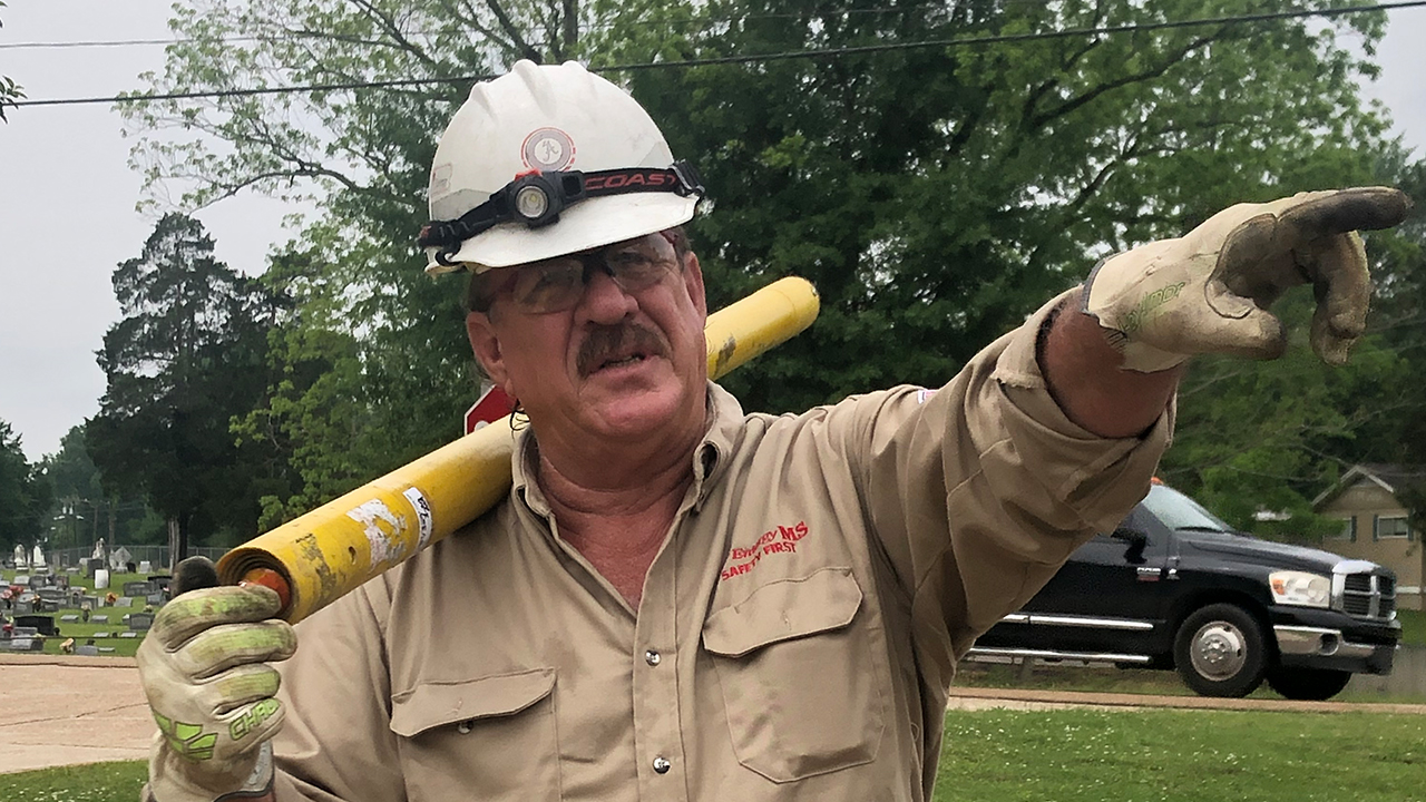 Gene Woolsey works to restore power after a storm on April 23, 2020 in Florence, Mississippi 